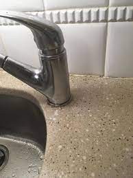 With this leak, water will leak from the area where the faucet base touches the escutcheon plate or countertop. How To Approach Fixing This Kitchen Sink Faucet Leak At The Base Home Improvement Stack Exchange