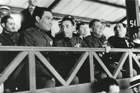 Sergeant fulgencio batista, center with hand on belt, seen september 7, 1933. A Brief History Of The Cuban Revolution