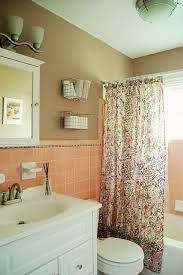 Simply by choosing pink tiles instead of white ones, this small bathroom becomes filled with endless personality. Lovely Nest Crafting A Lovely Home Lovely Nest Com Latest Bathroom Fix Pink Bathroom Tiles Retro Pink Bathroom Pink Tile Bathroom