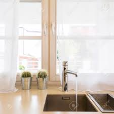 Kitchen sink with window stock photos offset. Minimalist Kitchen Sink With Steel Tap In Front Of Big Window Stock Photo Picture And Royalty Free Image Image 89845632