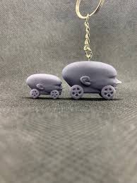 Da baby car is a photoshoped image of da baby's head on the wheels of a. Dababy Car Keychain Etsy