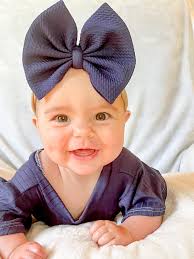 What color pageant dress would suit a child with light brown eyes, brown  hair, and a tan complexion?