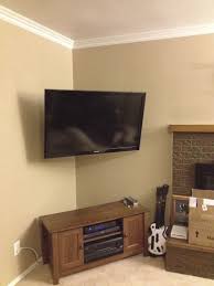 Corner Mounted Tv With The Wires Hidden Adds So Much Space In Your Bedroom And Gives It A Nice Clean Look Corner Tv Mounted Tv Corner Tv Cabinets