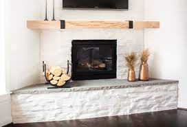Expand your firescape in a more contemporary look. From Dark Stone To Modern White This Amazing Fireplace Makeover Cost Less Than 100