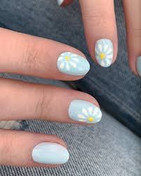 She has been practicing nail art for over 5 years and graduated from northampton college with distinction with a nail technician and manicurist these dots will be forming the center of the flower, so place them on your nails accordingly. 31 Flower Nail Art Designs Pretty Floral Manicures For 2021 Glamour