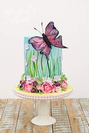 A few bigger versions of the same flowers decorate the sides together with some yellow and violet marzipan butterflies. Butterfly Decorations On Cakes Cake Trend Tuesday Cakeflix