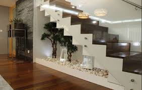 As a general rule, you don't want to place a sofa in front of a door because you don't want to block it, and you don't want people to walk into the back of the sofa. 21 Under Stairs Pebble Garden Ideas