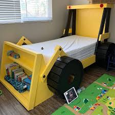 With this kind of bed, your storytelling before bedtime will even be more exciting! This Construction Truck Kids Bed Has A Built In Bookshelf In The Bucket