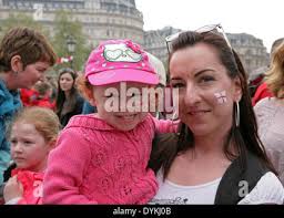 London, UK. 21st April, 2014. Hannah Wing and Lyann Hazelden had their  faces painted with the St George flag at the Feast of St George  celebrations in Trafalgar Square Credit: Keith Larby/Alamy