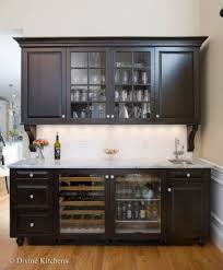 Wet Bar With Dark Raised Panel Cabinetry Crown Molding Corbels Wine Beverage Fridge And White Stone Counte Dining Room Bar Dining Room Buffet Kitchen Bar