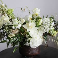 Charming tulips in elegant centerpieces. Beautiful White Flower Arrangements White Centerpiece Ideas