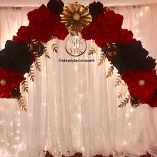 Red Black And Gold Backdrop Ideas This Stunning Paper Flower Arch With Red Gold And Black Roses Is Just So Beautiful Black And Gold Party Decorations Red Wedding Arch Gold Wedding Decorations