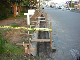 Add concrete curbs to define specific areas in your garden. Forming A Concrete Curb Fine Homebuilding