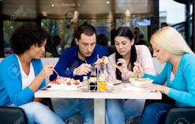 Group Of Teenagers Students On Lunch In Restaurant Stock Photo ...