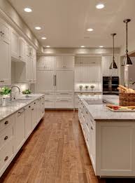 That said, more and more kitchens do have cabinets that extend to the ceiling, even with 9 or 10 foot ceilings. Glorious Seattle Granite Island Top Transitional Kitchen Countertop 10 Ft Ceiling Dream Kitchen Dove White Hand Scraped Floors Stone