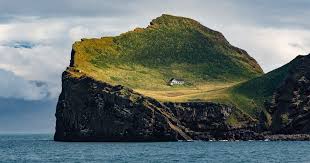 lonely island house in ocean