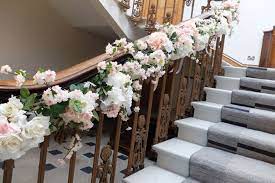Staircase Garland Of Roses Hydrangea And Blossom Silk Flower Garland Decorating The Staircase At Ha Wedding Flowers Laurel Wedding Wedding Reception Flowers