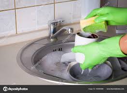 sink full of washing dishes  stock