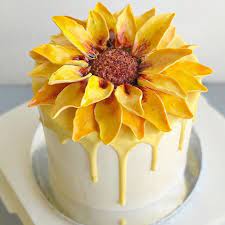 Featuring textured buttercream, ombre watercolour, hand piped sunflowers, wheat, and pumpkins, and hand sculpted and piped buttercream sun. 14 Sunflower Wedding Cake Ideas
