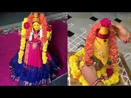 People apply saffron and sandal paste on the deity's forehead and also on the sacred pot. Varalakshmi Ammavari Saree And Kalasam Decoration Varalakshmi Kalasam And Saree Decoration Youtube Lakshmi Sarees Flower Decorations Spiritual Gifts