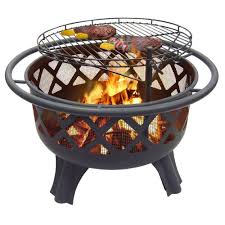 A wood grate is included to make your fires larger and more consistent as well as drain holes to keep your pit free of rainwater. Hampton Bay Crossfire 29 50 In Steel Fire Pit With Cooking Grate 25915 The Home Depot Portable Fire Pits Cool Fire Pits Fire Pit With Cooking Grate