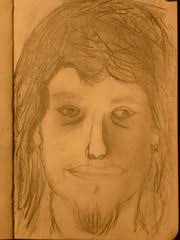 TANCAT. CURS 2010-2011. 18è EXERCICI. Autoretrat amb llapis marrà.