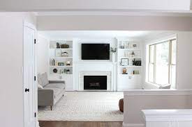 This photo gallery features a diverse set of beautiful living rooms with fireplaces. White Built Ins Around The Fireplace Before And After The Diy Playbook Built In Shelves Living Room Fireplace Built Ins Built In Around Fireplace