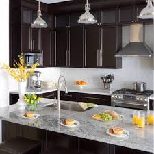 Dark cabinets light countertops light tile backsplash slightly. 5 Perfect Kitchen Countertop And Flooring Matches For Dark Cabinets