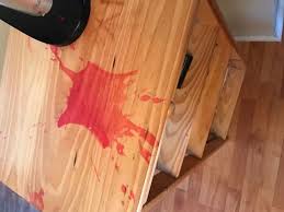 If it is truly build up from wax and not acrylic finishes like mop and glo or pledge then the easiest way to remove it is with a buffer and mineral spirits. How To Remove Candle Wax Stain From A Light Colored Wood Table Hometalk
