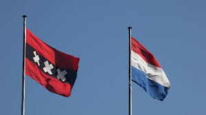 The dutch tricolour is the national flag, flag of the kingdom of the netherlands (which includes the netherlands antilles, aruba and until its independence in 1975 suriname), merchant flag, naval ensign and war flag. Flags Of Amsterdam And The Stock Footage Video 100 Royalty Free 6902404 Shutterstock