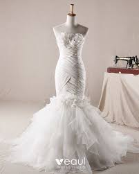 Mermaid wedding dress is one of the most popular silhouettes, and it is certainly not lacking in wow factor. Elegant Ruffles Applique Beading Strapless Organza Mermaid Wedding Dress