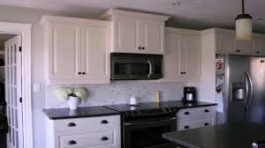 Think plank flooring, rustic cabinetry and crown molding. Kitchen Ideas With White Cabinets And Black Appliances Youtube