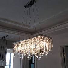 To help determine your rectangular crystal chandelier dining room style, take pictures of your rooms and pictures of your favorite pieces in that room. Rectangular Crystal Chandelier With Linear Design Dining Room In 2021 Crystal Chandelier Dining Room Dining Room Light Fixtures Chandeliers Crystal Chandelier Lighting