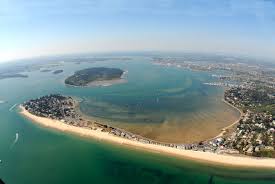Activities at sandbanks include crazy golf, a children's play area and the sandbanks beach cafe. Sandbanks Poole Harbour Dorset Places To Visit Aerial View Sandbank
