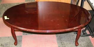 This coffee table presented is constructed from cherry veneer, making it quite sturdy. Oval Queen Anne Style Cherry Color Coffee Table