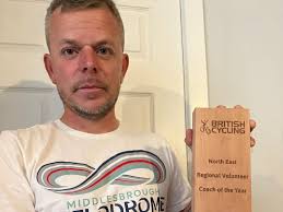 Cycling coach bursting with pride after scooping prize