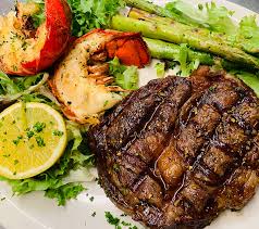 Rib eye steak lobster tail and asparagas. Rib Eye With Lobster Tail Platter Seafood World Calabash Seafood Buffet