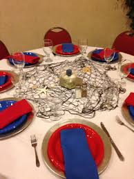 Planning this nautical themed baby shower was so fun! Nautical Table Setting For Baby Shower Nautical Table Baby Shower Table Decorations