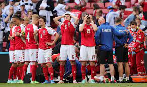 Denmark players surround stricken christian eriksen. 5ztq38r3zh Kbm