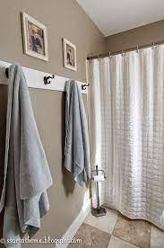 For those who want to go with something simple and classic, a nice metal hook will do the trick. Home Tour Bathroom Towel Hooks Bathroom Door Hooks Towel Rack Bathroom