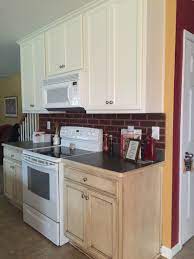 Two Tone Kitchen Upper Cabinets Painted With Behr Antique White Lower Cabine Painting Kitchen Cabinets Unfinished Kitchen Cabinets Laminate Kitchen Cabinets