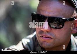 Army Reserve Staff Sgt. Devin Crawford, 108th Training Command, gets  himself in the zone before firing at a CIOR pistol exercise near  Hammelburg, Germany