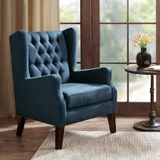 Featuring gorgeous button tufting on the back and a rolled top, these chairs are sure to turn heads at any dinner party or family gathering. Roan Navy Wingback Button Tufted Accent Chair Style 82w87 Lamps Plus