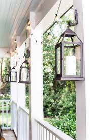 Match your brown wooden ceiling with army green furniture above the beautiful tiles for porch flooring. Porch Lighting Ideas To Add Charm To Your Exterior