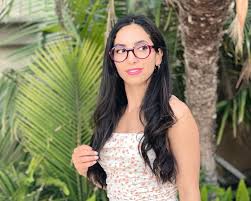 Mariam is wearing a selection of frames by Struktur Eyewear -