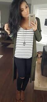 Black And White Striped Shirt Outfit Women S Winter Outfits Black And White Striped Scoop Neck Shirt With Green Coat And Distressed Black Pants Cute Winter Outfits Fashion Clothes