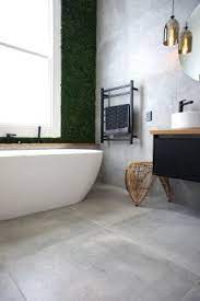 This cozy bathroom from cathie hong does just that, where the patterned floor tile add visual interest, and the large subway tile on the walls form a uniform setting for rest of the bathroom's decor. Large Floor Tiles Emerge As A Leading Trend For Melbourne Bathrooms Rms Traders