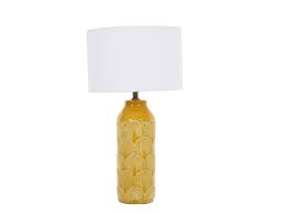The unit measures 17 inches high and will sit easily on any desk, nightstand or end table. Lamp Embossed Mustard Ceramic Table Lamp