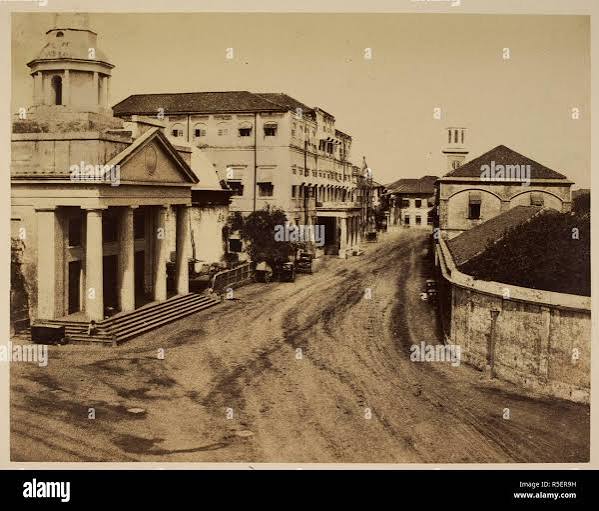 A view looking north along Apollo Street, Bombay, showing the Scottish Church on the left-hand side. Views In The Island Of Bombay. India, late 1850s. Source: Photo 960/1(2). Author: Scott, Charles Stock