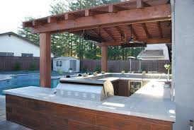 Outdoor kitchen designs can range from rustic or naturalistic to ones that focus more on elegance and luxury. Outdoor Kitchen Design Archives Hawkins Pools Design And Construction